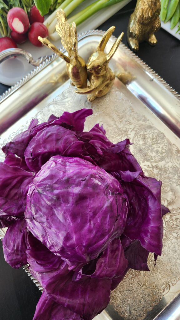 silver tray with gold bunny on top and purple cabbage