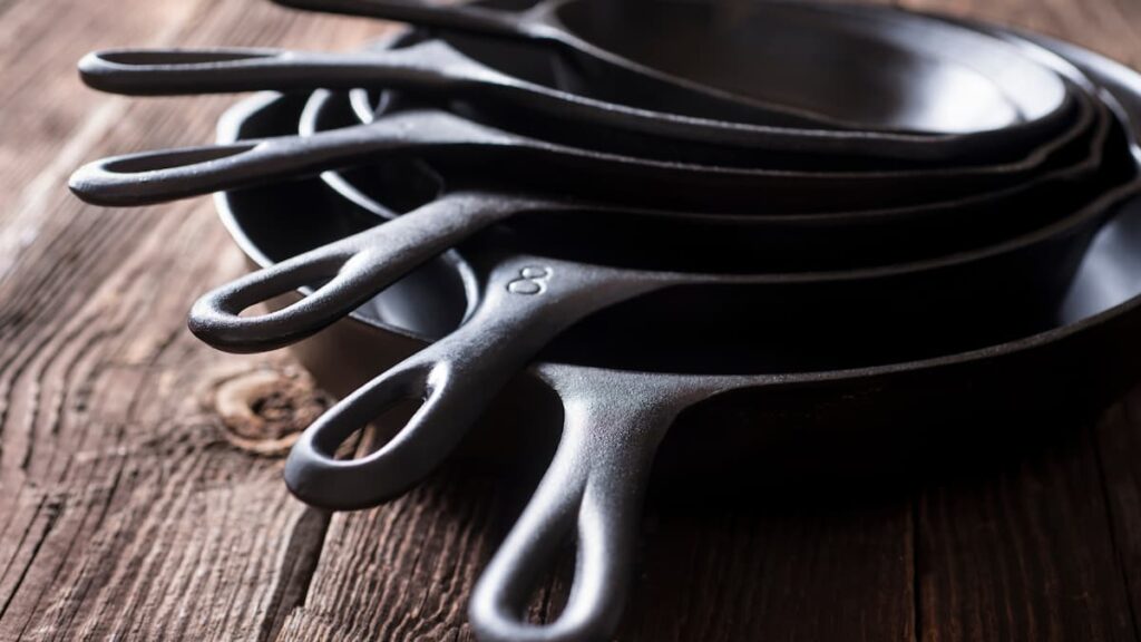 cast iron skillet piled on top of each other