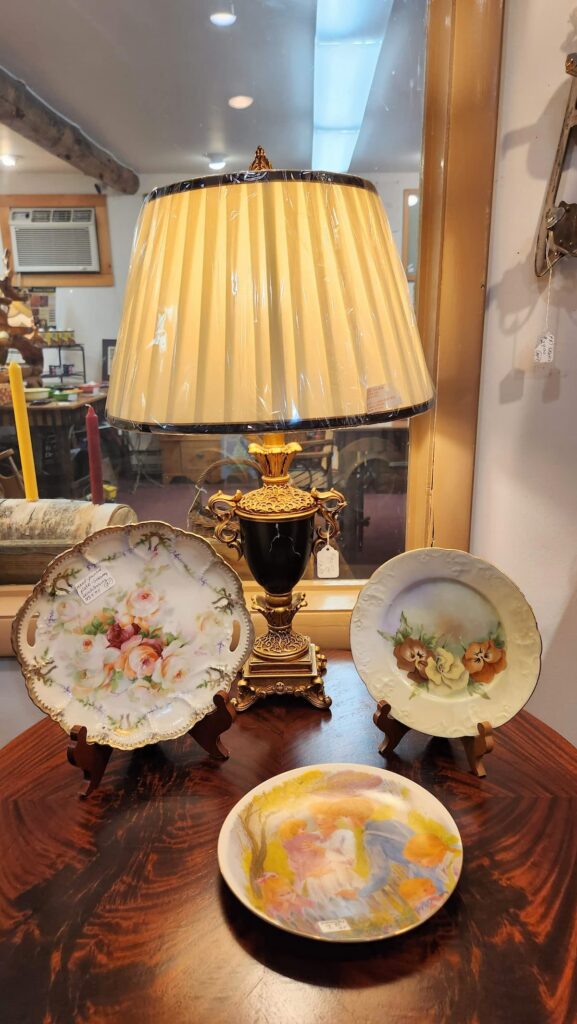 old vintage lamp with dishes on a table