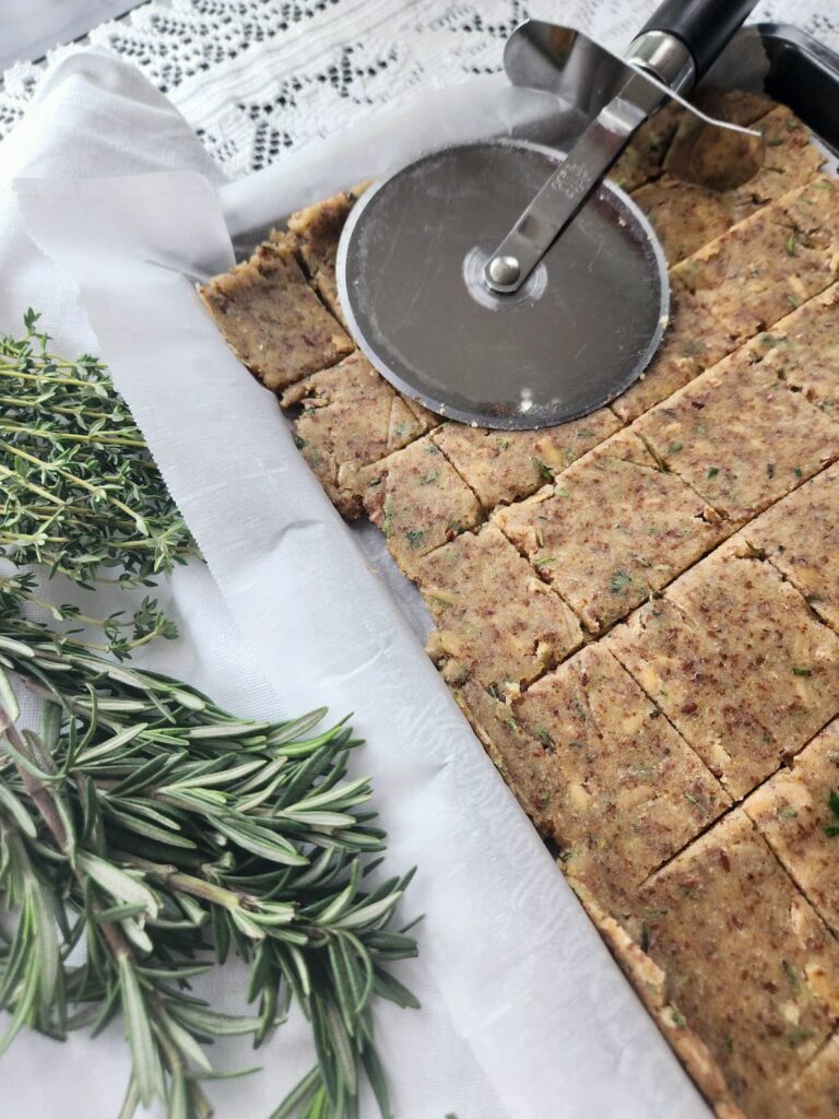 crispbread that is cut into squares on baking sheet