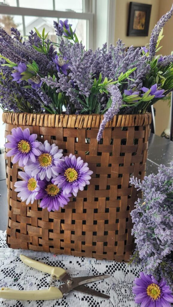 lavender stems in door hanger with purple daisies glued to the front of the basket
