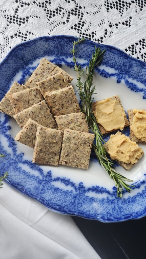 rosemary gluten free crispbread crackers on blue antique dish