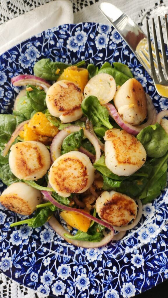 scallop salad on blue dish