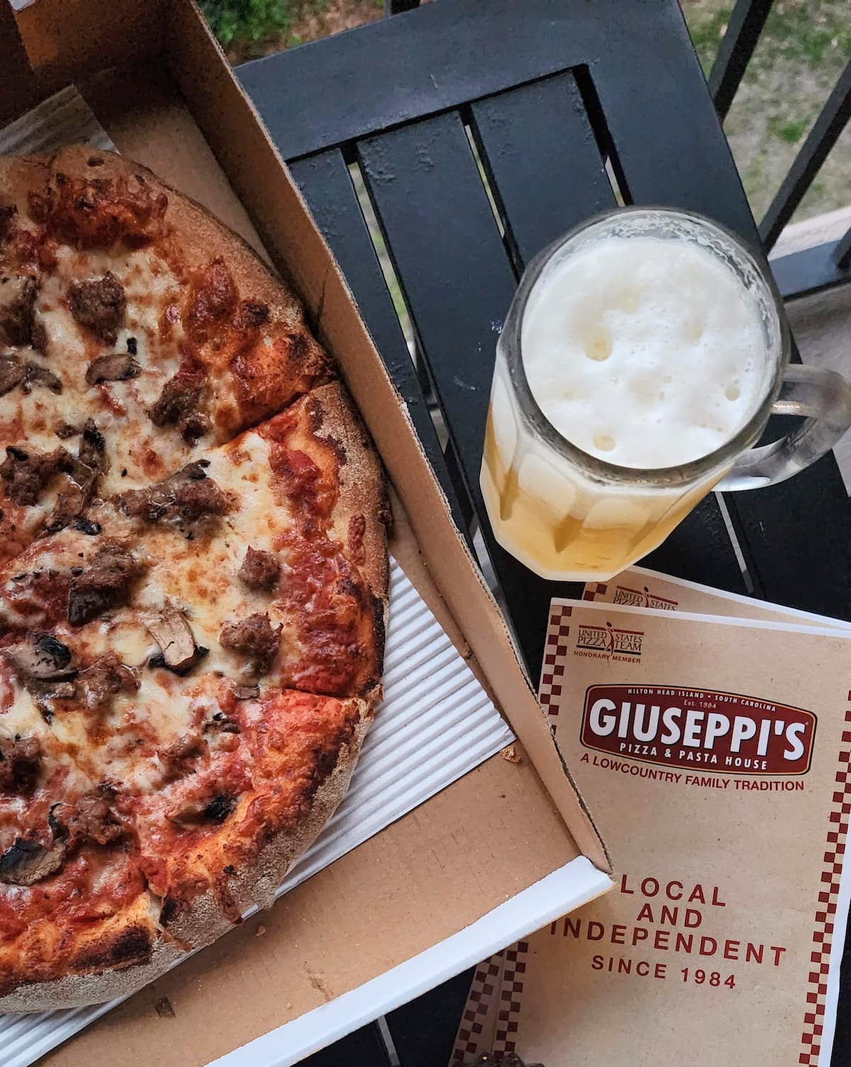 overhead view of giuseppi's pizza and menu