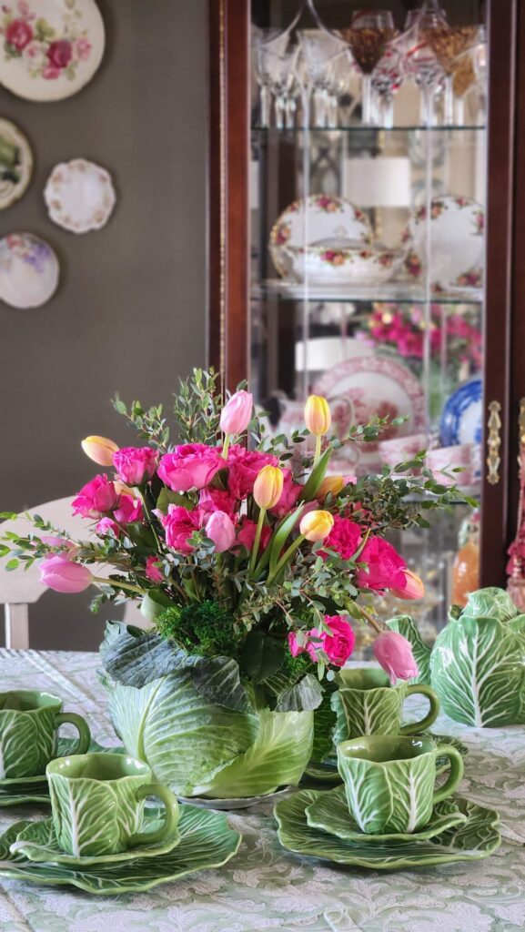 dining room with floral cabbage arrangement on table