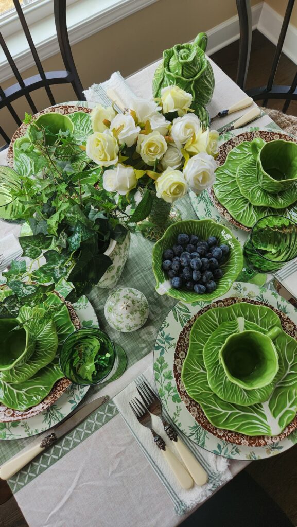 overhead view of green cabbage ware dishes on table