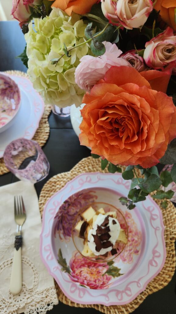 overhead photo of lemon curd in bowl with floral bouquet