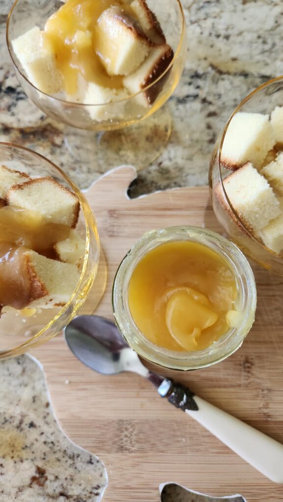 cubed pound cake in glass jars with lemon curd