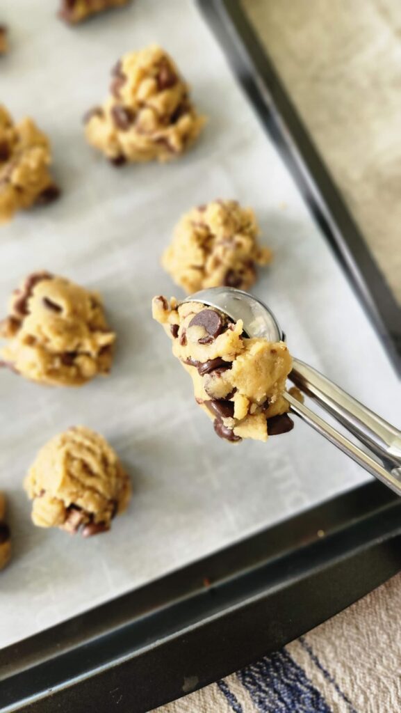 scooping cookies onto baking tray