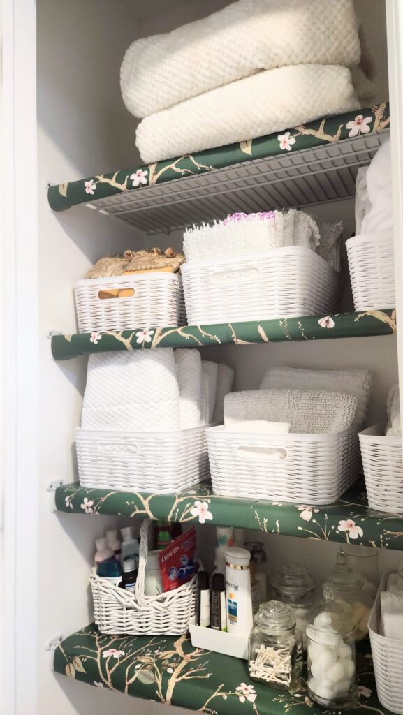 linen closet that is organized and neat