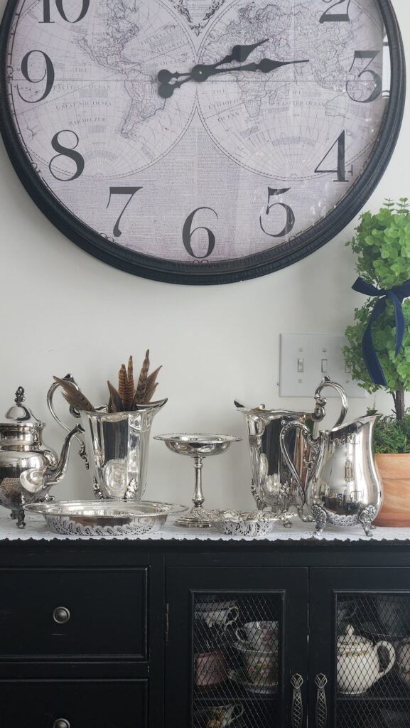 sideboard from front view with silver plated collection on it