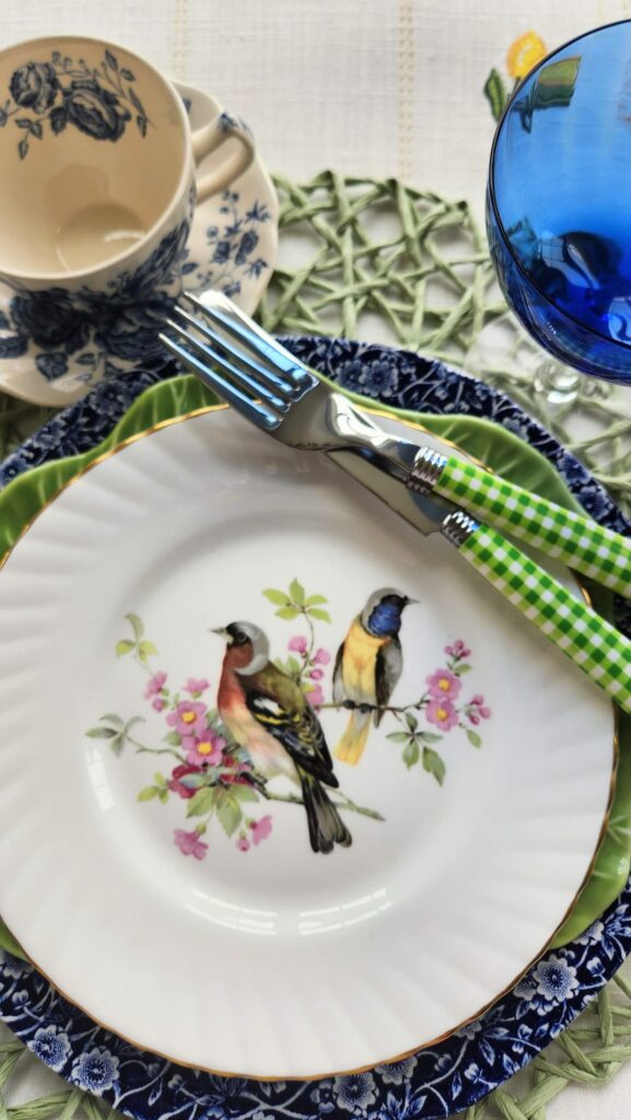 blue chintz dishes with bird plate on top