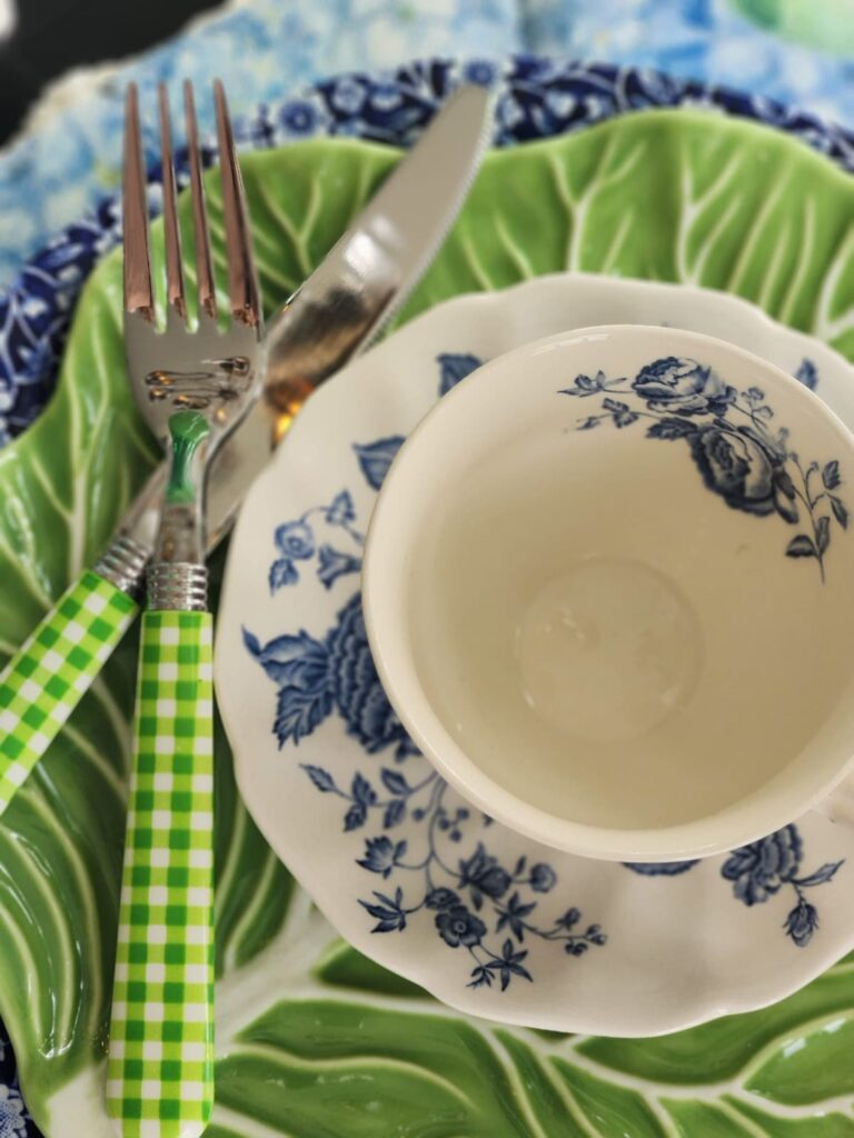 blue floral dishes with green checked silverware