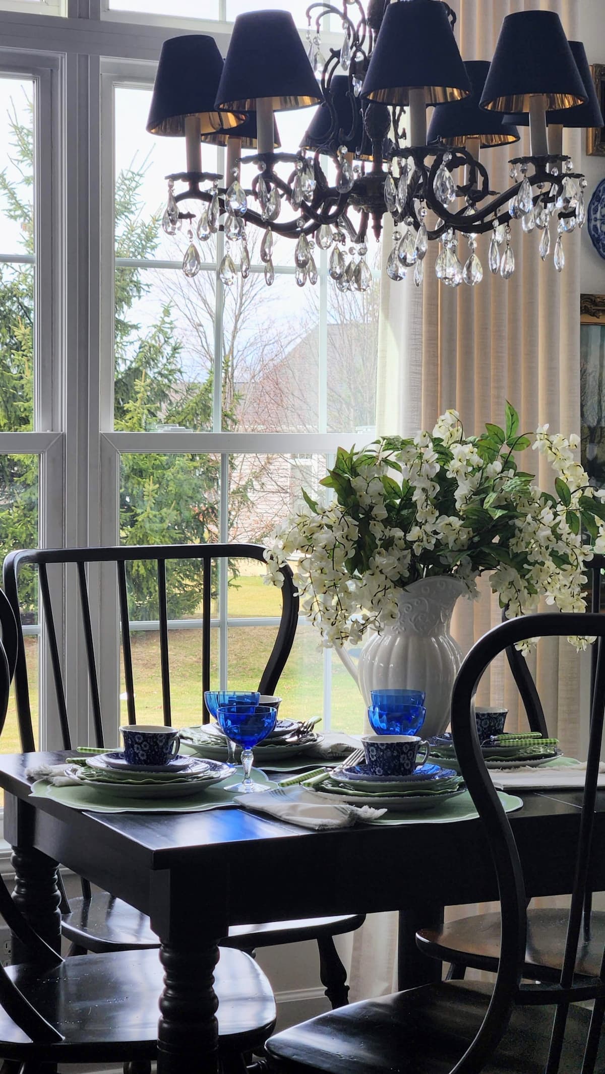 full view of table with mismatched dishes set
