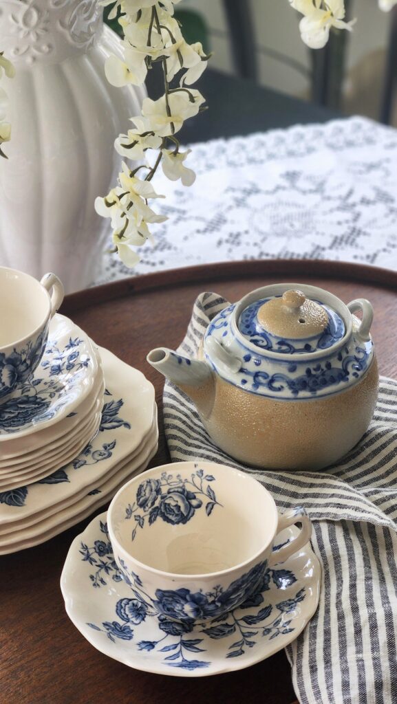 Vintage chinoiserie teapot on wooden tray breakfast room French country styling