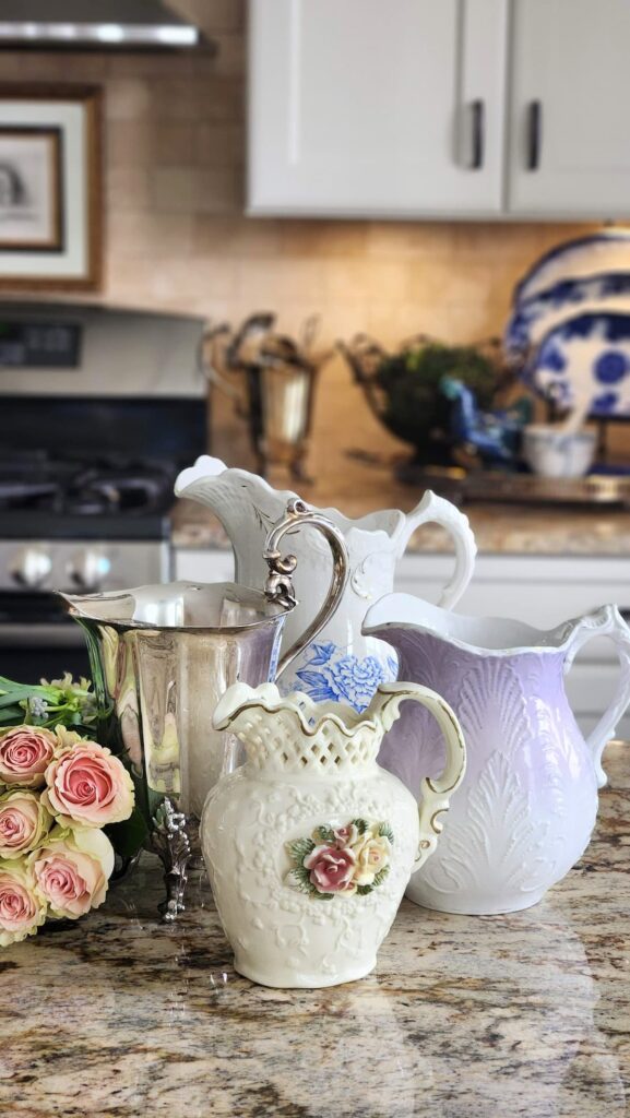 Vintage vase collection for spring flower arrangements kitchen counter silver pitcher lavender ceramic blue floral white embossed pitchers pink roses