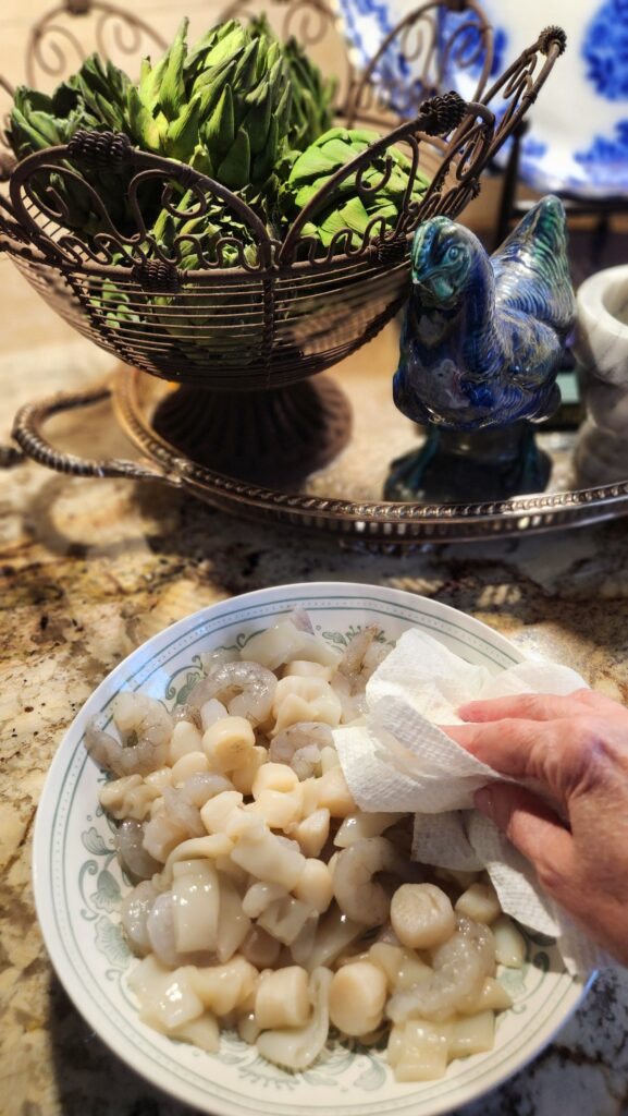 patting trader joes frozen seafood blend dry with paper towels before cooking