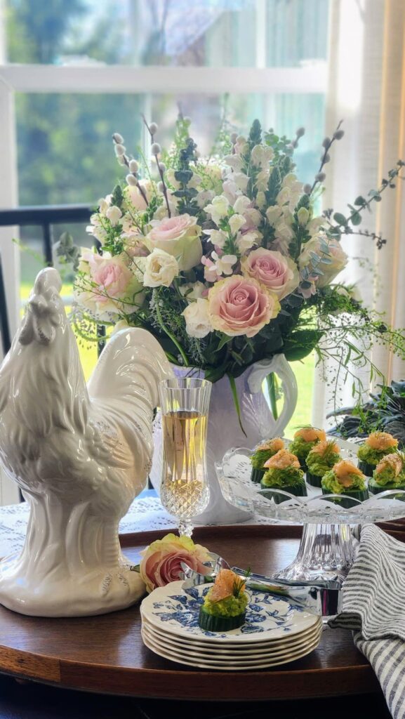 easy smoked salmon cucumber bites appetizer on crystal stand with spring flowers and rooster for entertaining